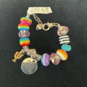 A bracelet with many different beads and charms.