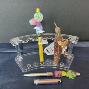 A pen holder with pens and pencils on it