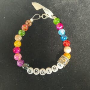 Colorful beaded bracelet spelling "brainy"