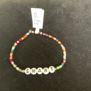 Colorful beaded bracelet spelling SMART.
