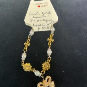 Handmade pearl and gold charm bracelet.