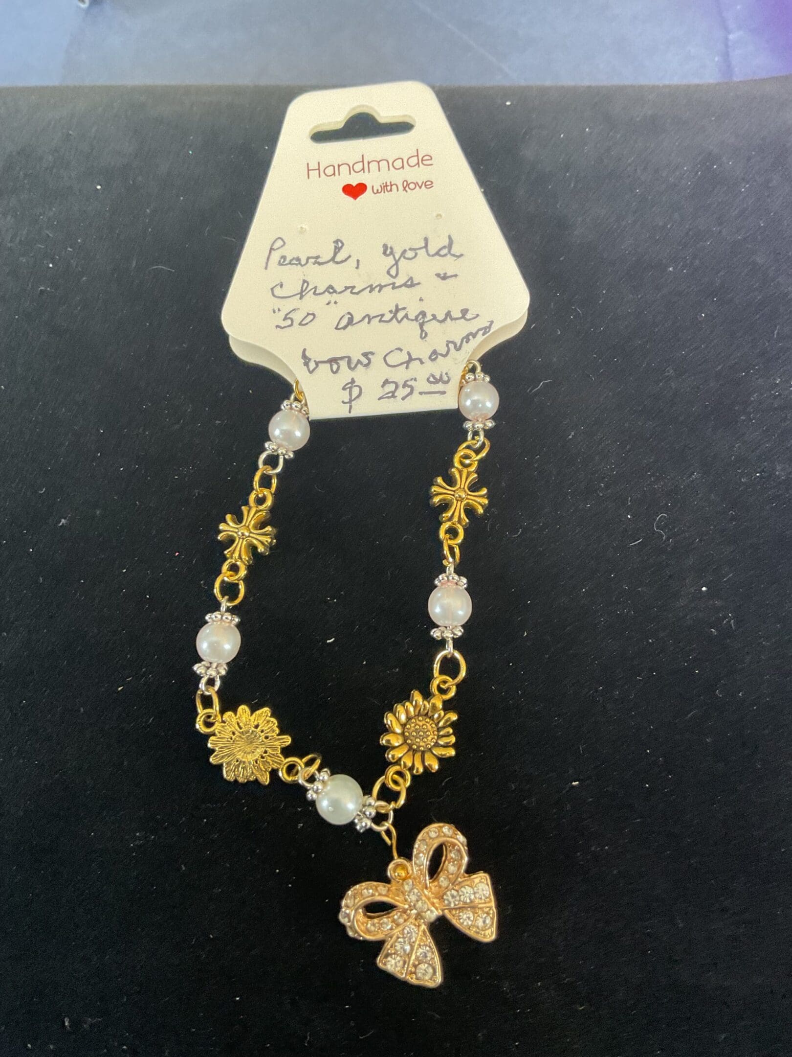 Handmade pearl and gold charm bracelet.