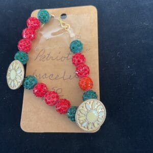 Red, green, and gold beaded bracelet.