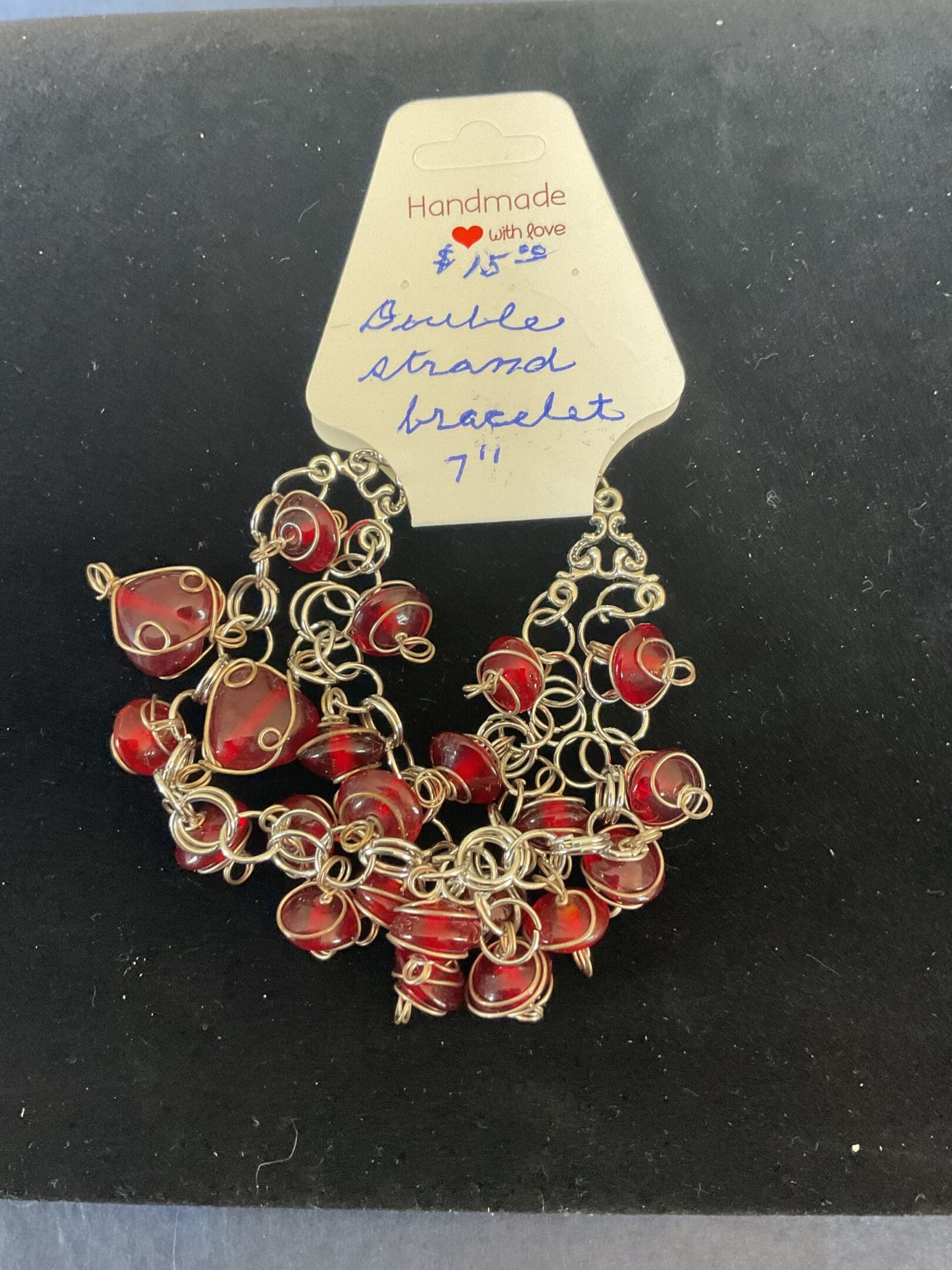 Handmade red glass bead bracelet.