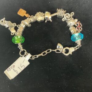 Silver charm bracelet with colorful beads.
