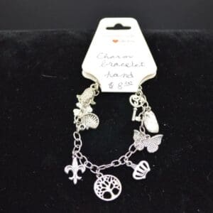 Silver charm bracelet with tree of life.
