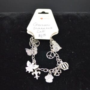 Silver charm bracelet with various pendants.