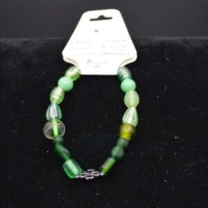 Green glass bead bracelet with shamrock.